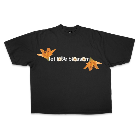Black t-shirt with floral designs and 'let love blossom' motto